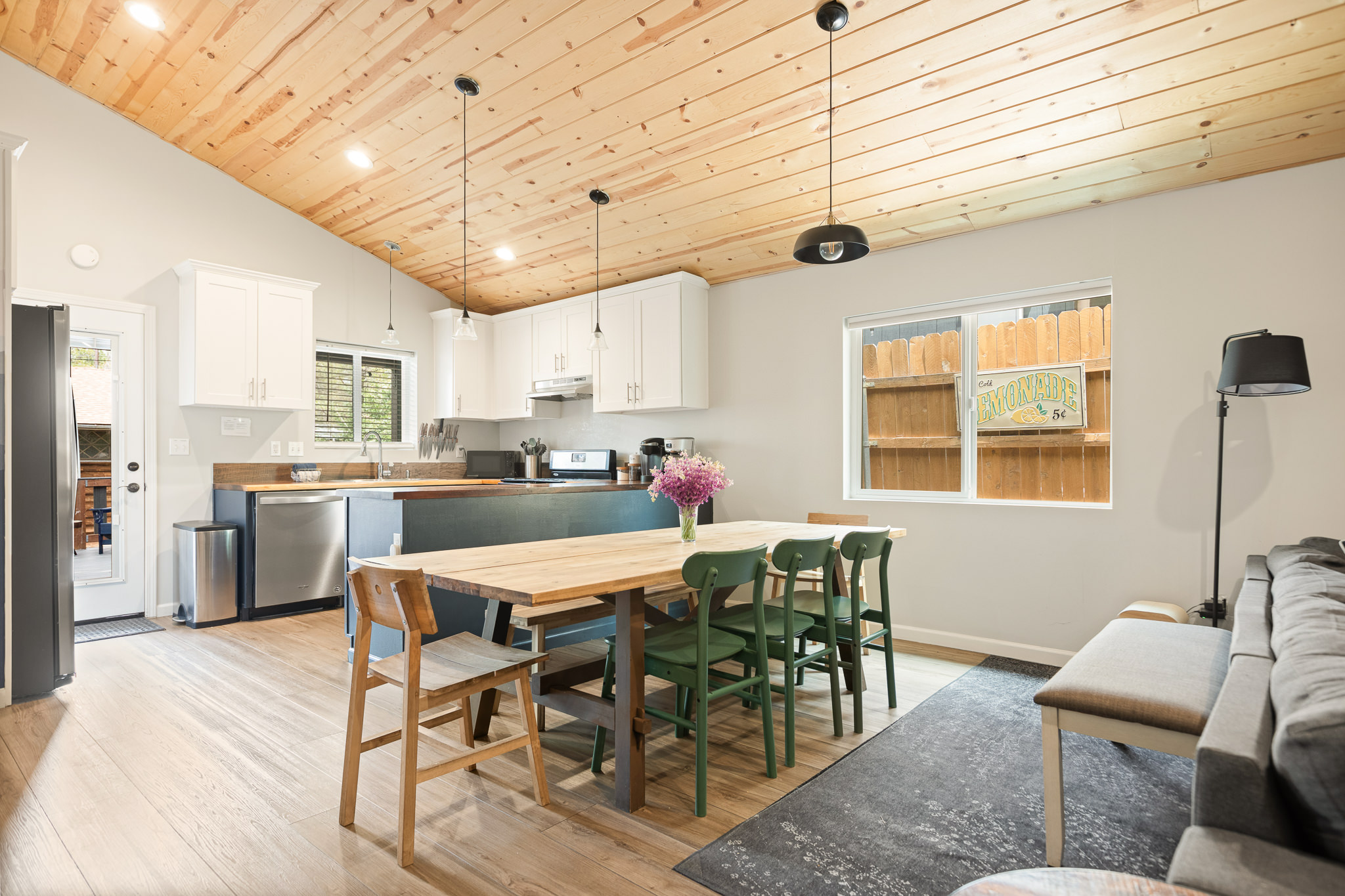 Dining table with green chairs at The Big Bear Cubhouse