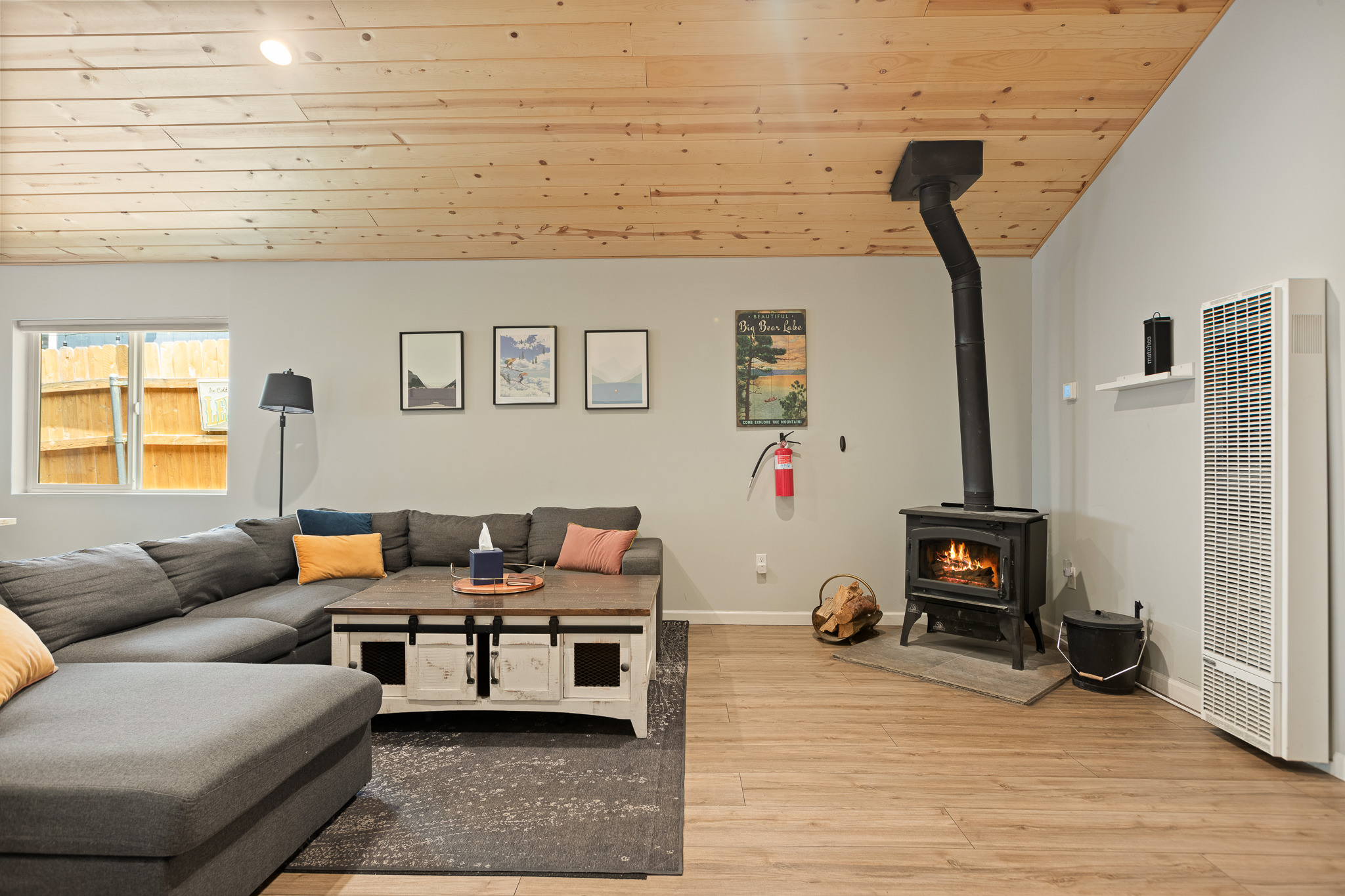 Indoor fireplace and sectional seating in the Cubhouse living room