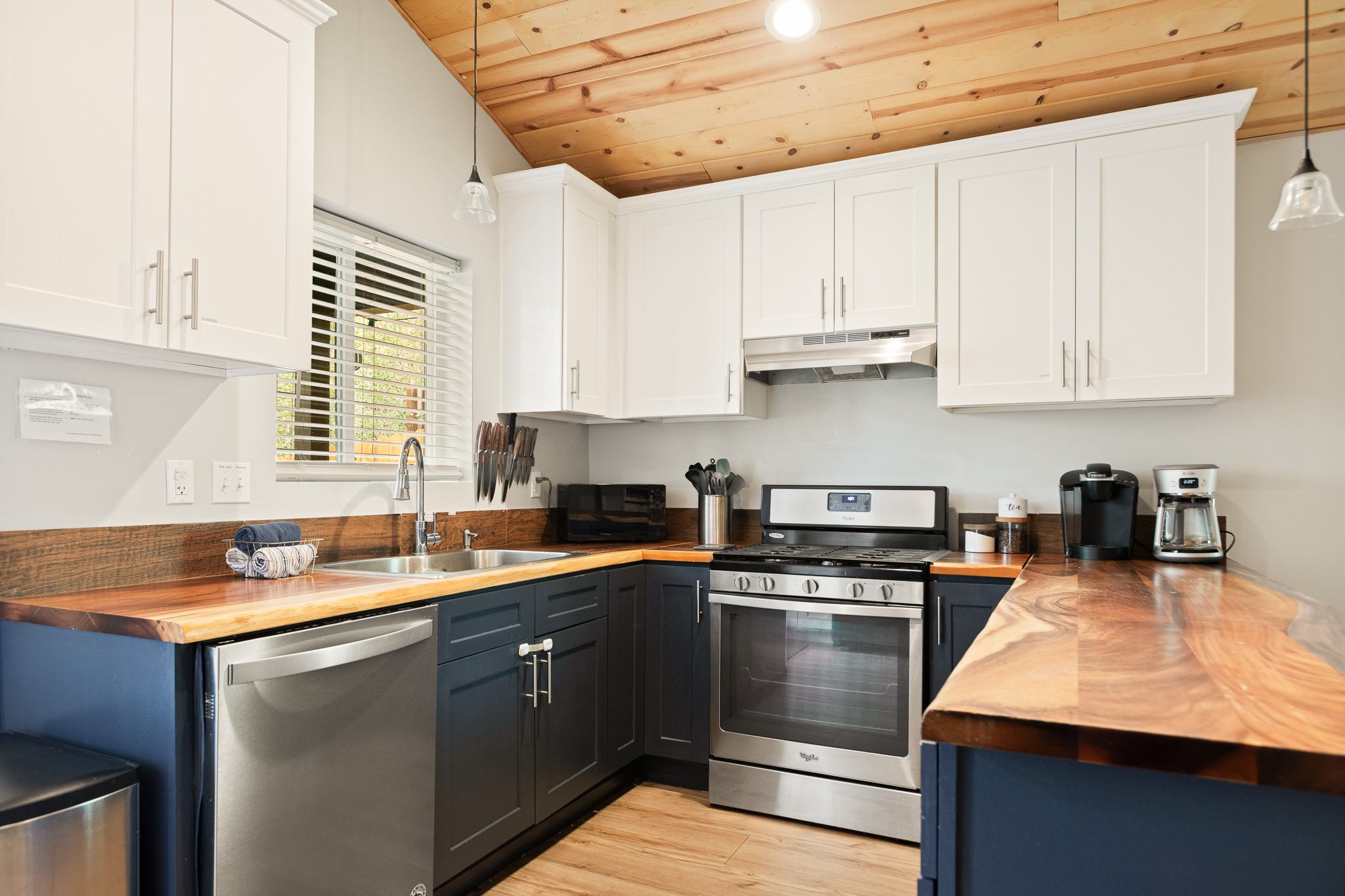 Navy blue full kitchen with butcher block counters at Big Bear cabin