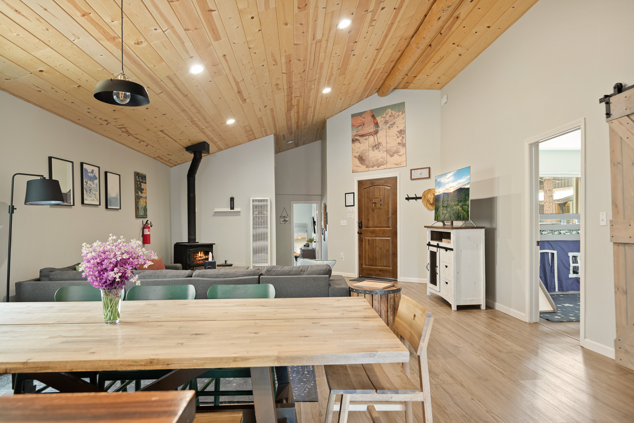 Dining area beneath the wood ceiling at The Big Bear Cubhouse