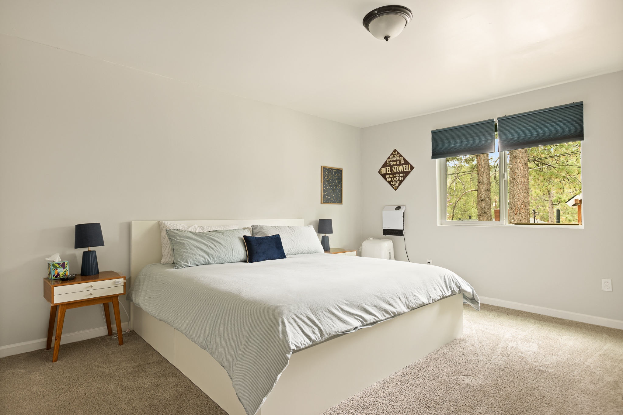 Bright king bedroom with neutral tones at The Big Bear Cubhouse